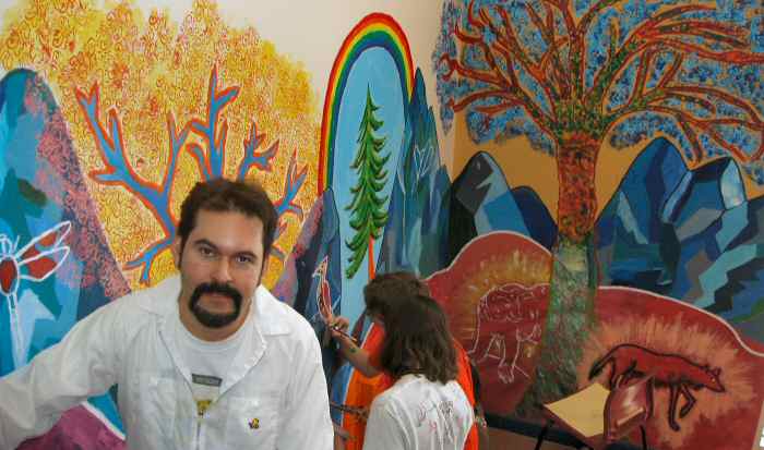 Marcio Melo works with students on a Mural Project at Symmes Junior HIgh in Gatineau, Quebec