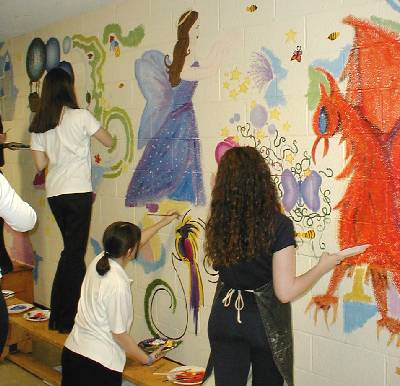 The muralists hard at work
